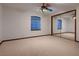 Bedroom with a large mirrored closet and natural light at 1 Quail Run Rd, Henderson, NV 89014