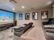 Living room featuring an aquarium, theater-style seating, and stylish decor at 1 Quail Run Rd, Henderson, NV 89014