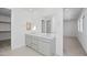 Bathroom with double vanity, large mirror and access to walk-in closet at 106 Via Franello, Henderson, NV 89011