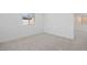 Bright bedroom with grey carpet and window views at 106 Via Franello, Henderson, NV 89011