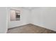 Simple bedroom with wood-look tile flooring and window at 106 Via Franello, Henderson, NV 89011