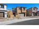 Two-story house with gray garage door and landscaping at 106 Via Franello, Henderson, NV 89011