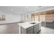 Open concept kitchen with island and access to the backyard at 106 Via Franello, Henderson, NV 89011