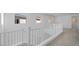 Loft area with white railing and carpet flooring at 106 Via Franello, Henderson, NV 89011