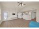 Open living room with vaulted ceilings, wood-look floors, and an open floorplan that includes the kitchen at 10001 Peace Way # 2322, Las Vegas, NV 89147