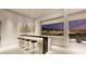 Stylish bar area with pendant lighting, sleek countertops, and picturesque city views at 616 Scenic Rim Dr, Henderson, NV 89012