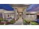 Modern home with a covered entryway, desert landscaping, and city views at 616 Scenic Rim Dr, Henderson, NV 89012