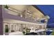 Modern home featuring a sleek design, spacious balcony, and inviting pool with ample seating at 616 Scenic Rim Dr, Henderson, NV 89012