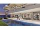 Stunning modern home featuring a luxurious pool, spacious patio, and ocean views, perfect for outdoor living and entertaining at 616 Scenic Rim Dr, Henderson, NV 89012