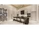 Contemporary kitchen with a large island, bar seating, modern appliances, and sleek cabinetry for ample storage at 616 Scenic Rim Dr, Henderson, NV 89012