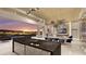 Open-concept kitchen with granite countertops, stainless steel appliances, and city skyline view at 616 Scenic Rim Dr, Henderson, NV 89012