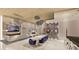 Open-concept living space featuring a modern fireplace, dining area, wine storage, and comfortable seating arrangements at 616 Scenic Rim Dr, Henderson, NV 89012