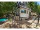 Mountain home showcasing backyard play area and tranquil water feature, merging nature with home appeal at 4205 Mont Blanc Way, Las Vegas, NV 89124