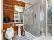 Cozy bathroom featuring a tiled shower, toilet, and a pedestal sink at 4205 Mont Blanc Way, Las Vegas, NV 89124