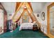 Unique A-frame bedroom featuring wood ceilings, a balcony, and natural light at 4205 Mont Blanc Way, Las Vegas, NV 89124