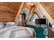 Unique A-frame bedroom featuring wood ceilings, a balcony, and natural light at 4205 Mont Blanc Way, Las Vegas, NV 89124