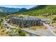 Exterior view of the large building with rustic wood and stone features nestled in a lush mountain landscape at 4205 Mont Blanc Way, Las Vegas, NV 89124