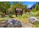 Kyle Canyon Picnic Area and Campground signs amidst greenery and boulders at 4205 Mont Blanc Way, Las Vegas, NV 89124