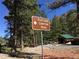 Fletcher Canyon Trail sign on a clear day next to trees and building at 4205 Mont Blanc Way, Las Vegas, NV 89124