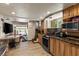 Charming kitchen featuring wood cabinets, granite countertops, and stainless steel appliances at 4205 Mont Blanc Way, Las Vegas, NV 89124