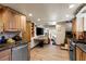 Charming kitchen featuring wood cabinets, granite countertops, and stainless steel appliances at 4205 Mont Blanc Way, Las Vegas, NV 89124