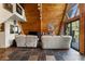 Bright living room with wood paneling, tile floors, and large sliding doors leading to outdoor space at 4205 Mont Blanc Way, Las Vegas, NV 89124