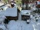 Aerial shot of wooden playhouse and cabin covered in snow with play equipment in the background at 4205 Mont Blanc Way, Las Vegas, NV 89124