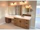 Modern bathroom with double vanity and large mirror at 5569 Artex Ave, Las Vegas, NV 89139