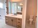 Elegant bathroom with double vanity and toilet at 5569 Artex Ave, Las Vegas, NV 89139