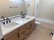 Modern bathroom with double vanity and bathtub at 5569 Artex Ave, Las Vegas, NV 89139