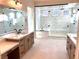 Luxurious bathroom with large shower and soaking tub at 5569 Artex Ave, Las Vegas, NV 89139