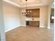 Elegant dining area with a built-in wet bar, chandelier and hardwood floors at 5569 Artex Ave, Las Vegas, NV 89139