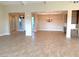 Open concept dining room with wood-look tile floors at 5569 Artex Ave, Las Vegas, NV 89139