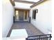 Covered entryway with tile flooring and a pathway leading to the front door at 5569 Artex Ave, Las Vegas, NV 89139