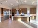 Modern kitchen with large island, stainless steel appliances, and custom cabinetry at 5569 Artex Ave, Las Vegas, NV 89139