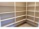 Walk-in pantry with ample shelving for storage at 5569 Artex Ave, Las Vegas, NV 89139