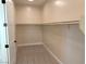 Spacious walk-in closet with ample hanging space at 5569 Artex Ave, Las Vegas, NV 89139