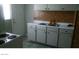 Kitchen featuring white cabinets and a double sink with a view to the outside at 1707 Santa Paula Dr, Las Vegas, NV 89104