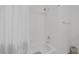Shower with white tile in an otherwise all-white bathroom at 3179 Surf Spray St, Las Vegas, NV 89117