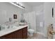 Clean and bright bathroom featuring vanity with a sink and shower with glass door at 3179 Surf Spray St, Las Vegas, NV 89117
