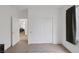 Bedroom with dark curtains, double-door closet, and view into what appears to be an office or reading room at 3179 Surf Spray St, Las Vegas, NV 89117
