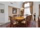 Formal dining area with a large wooden table, ornate chairs, and elegant window treatments at 3179 Surf Spray St, Las Vegas, NV 89117