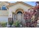 Inviting front entrance featuring a decorative security gate and stylish double doors with an arched transom at 3179 Surf Spray St, Las Vegas, NV 89117