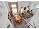 High angle of the foyer with chandelier and large dining table with seating at 3179 Surf Spray St, Las Vegas, NV 89117