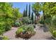 Lush garden with brick planter, perfect for adding a touch of nature and tranquility to your home at 3179 Surf Spray St, Las Vegas, NV 89117
