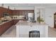 Bright kitchen with granite countertops, stainless steel appliances, and breakfast bar at 3179 Surf Spray St, Las Vegas, NV 89117