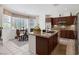 Bright kitchen with granite countertops, stainless steel appliances, and breakfast nook at 3179 Surf Spray St, Las Vegas, NV 89117