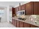 Modern kitchen with stainless steel appliances and granite countertops at 3179 Surf Spray St, Las Vegas, NV 89117