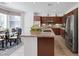 Bright kitchen with granite countertops, stainless steel appliances, and breakfast nook at 3179 Surf Spray St, Las Vegas, NV 89117