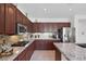 Gourmet kitchen with granite countertops, stainless steel appliances, and gas cooktop at 3179 Surf Spray St, Las Vegas, NV 89117